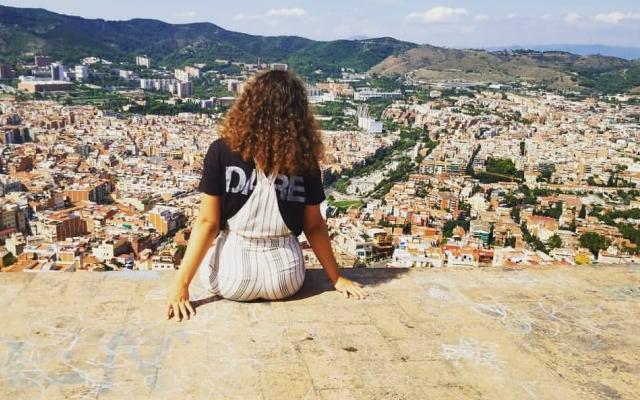 Young woman looking over the Barcelona skyline