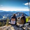 two adults and two kids atop a mountain