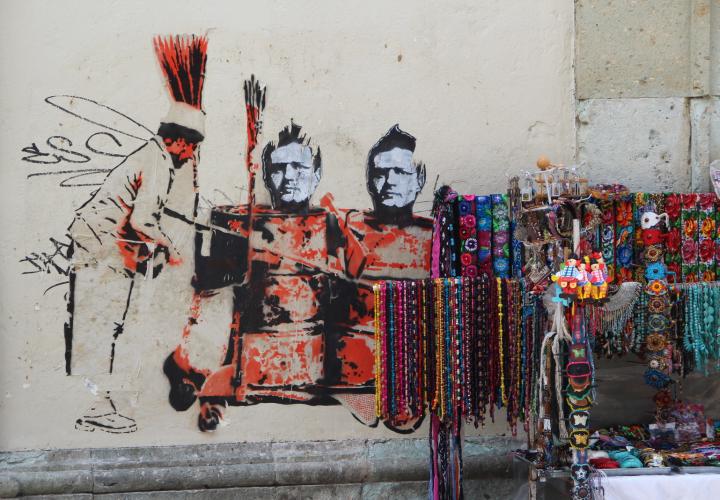 Mural of Indigenous Mexican soldiers spray painted on wall