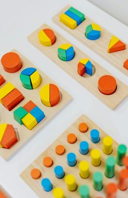 A picture of toy blocks in different colors and sizes.