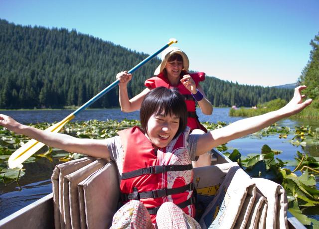 Two students enjoying a canoe ride