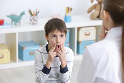 A child learns ASL.