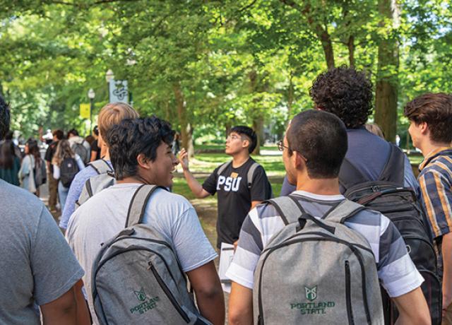An orientation leader shows new students around the PSU Park Blocks.