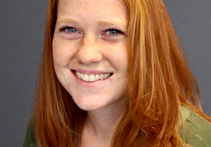 Photo of Employment Coordinator Stephani Day, a young woman with red hair and fair skin.