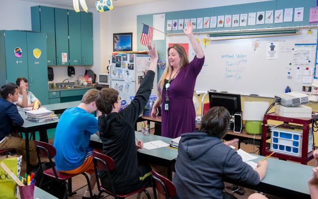 Portland State University special education student helping with students in a classroom