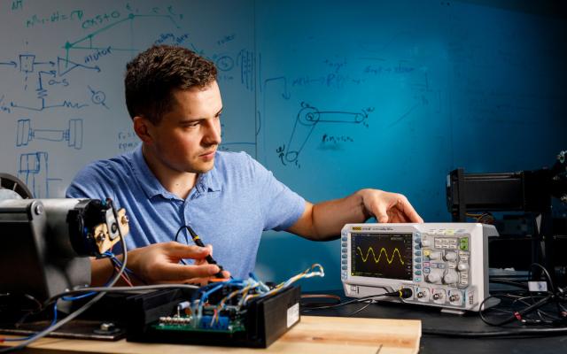 a student soldering