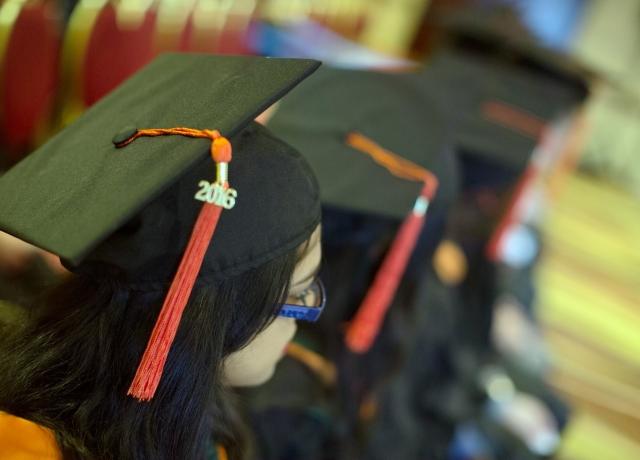 MS graduation hats on heads