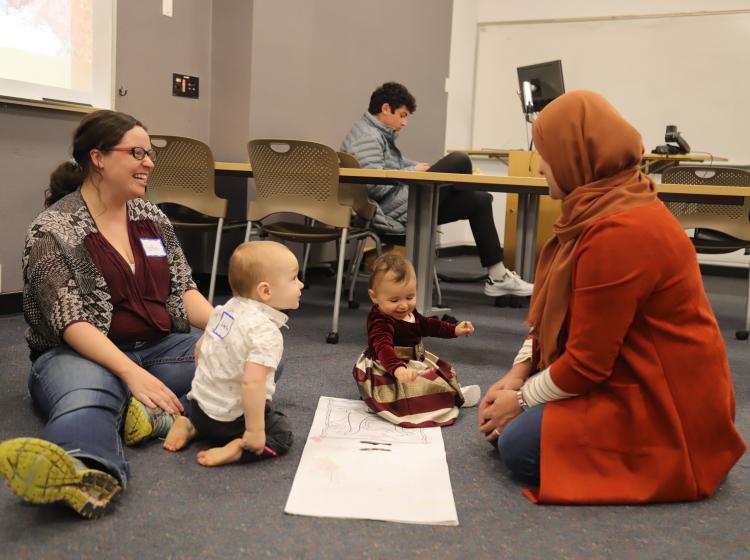 Student parents talking at ETM Potluck