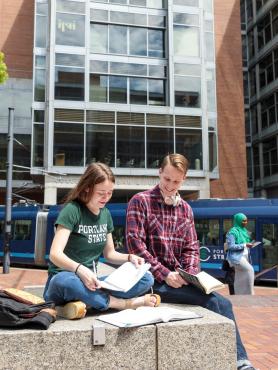 Students sitting together and studying outside on Portland State campus