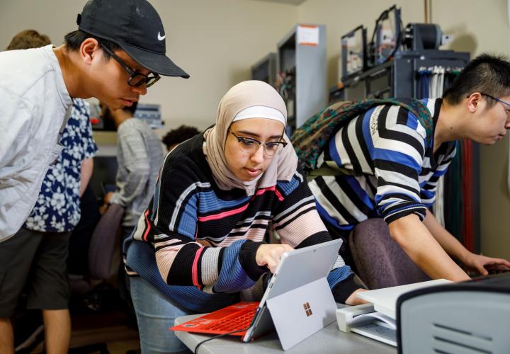 Students working together on computer