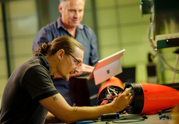 Student and professor working on electrical engineering