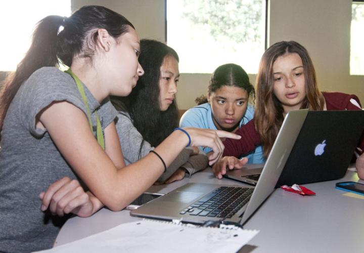 Students working on computer together