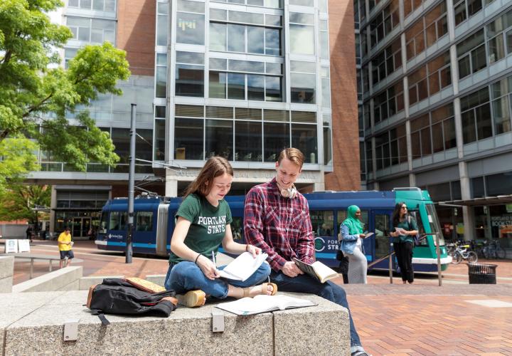 Students sitting together and studying outside on Portland State campus