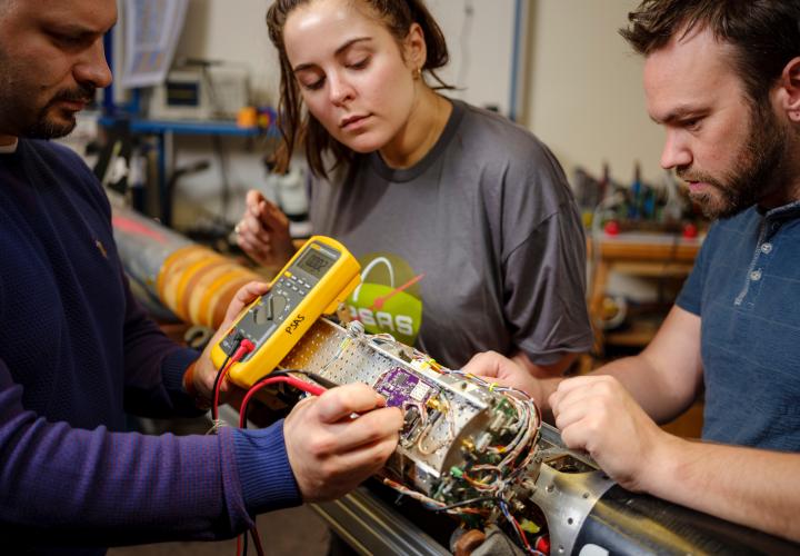 Students working on rocket