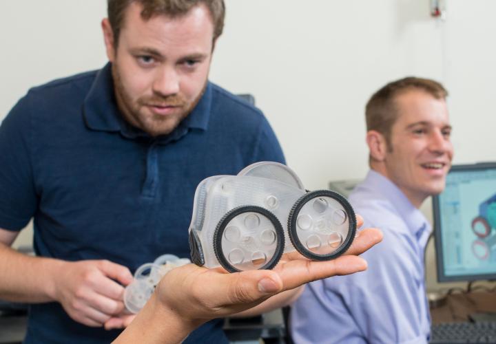 three psu materials science and engineering graduate students working on a project