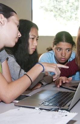 Students working on computer together