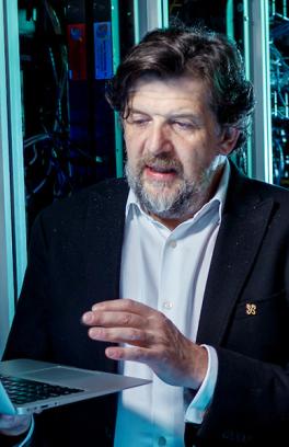 PSU computer science graduate student working with a faculty member in a computer lab