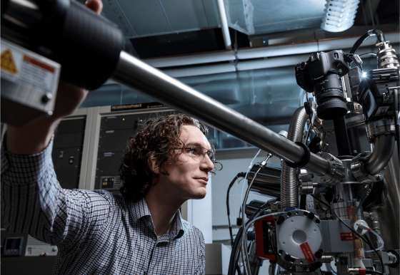 A man manipulates a large piece of machinery