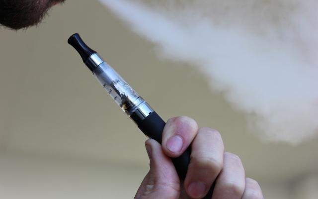 man smoking e-cigarette