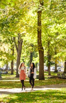 Two people walking outside