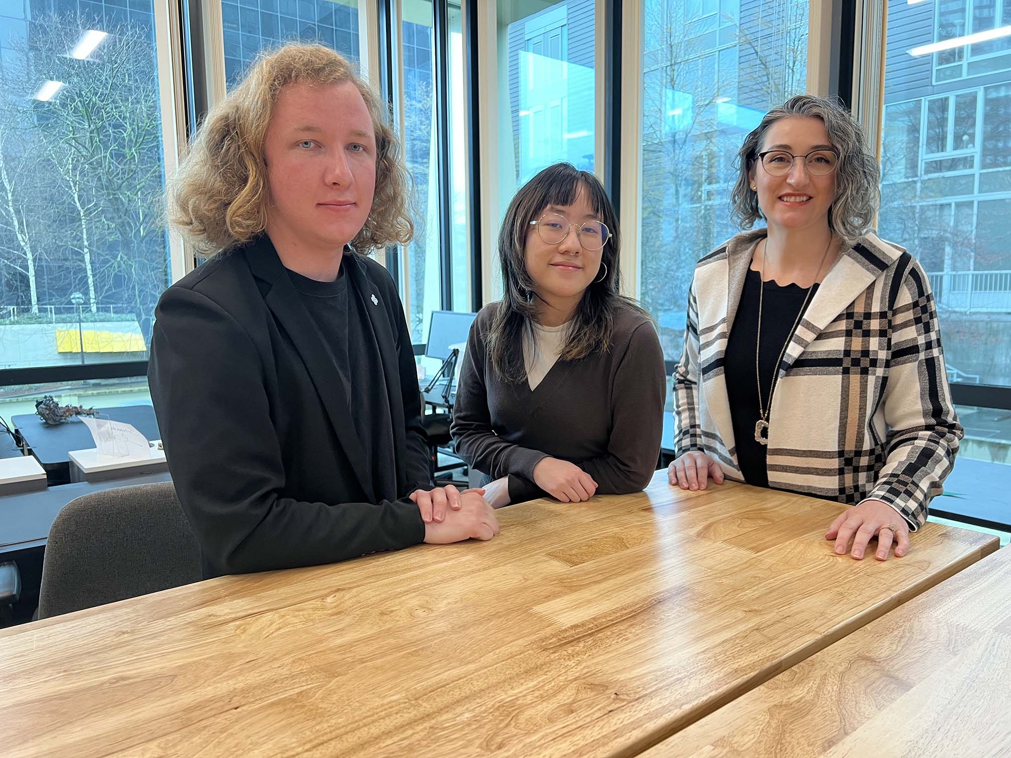 Blake Turner from Turner Automative, Reed Le from Cleantech Challenge team Copiosus, and Abigail Van Gelder, Assistant Program Manager for the Center for Entrepreneurship.