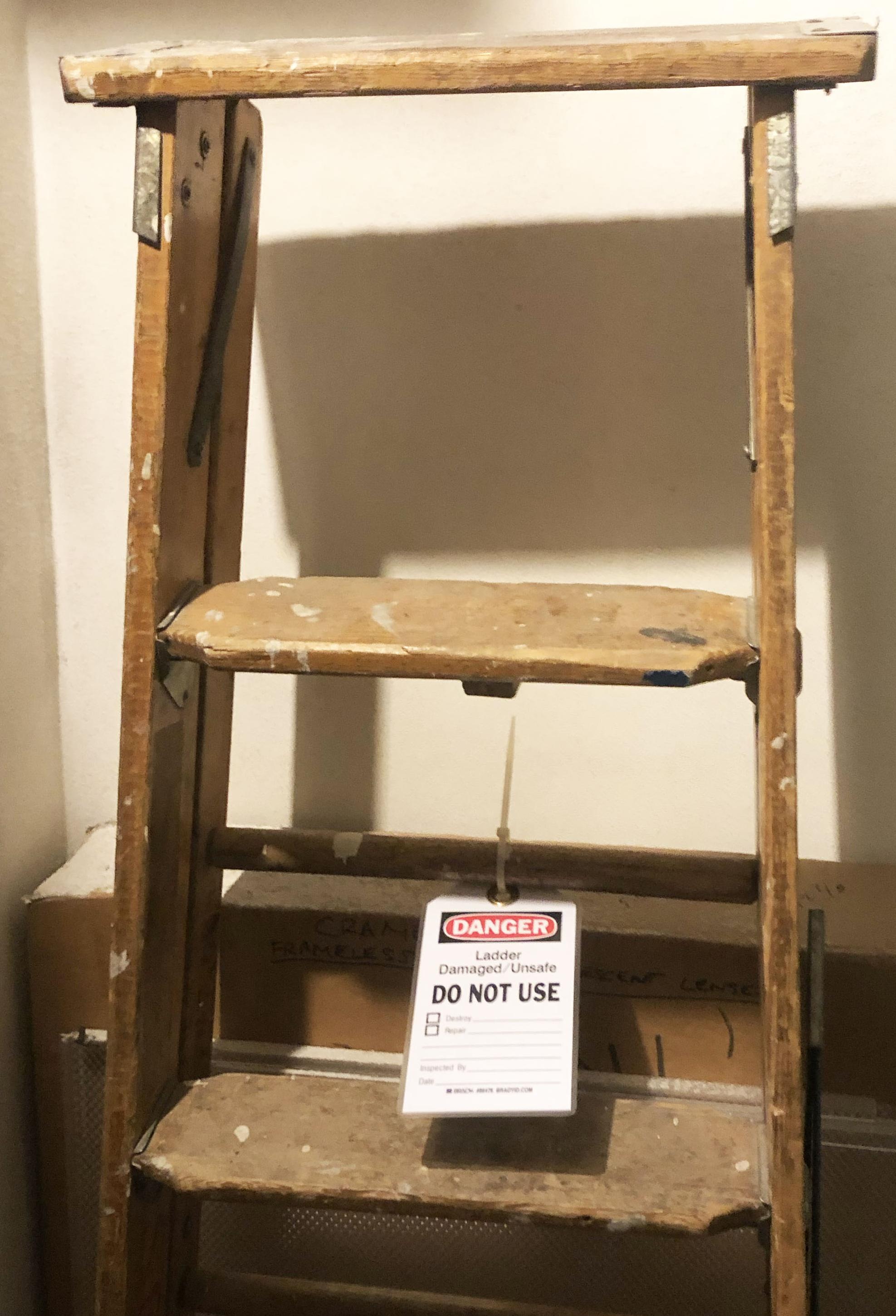 wooden ladder with do not use tag