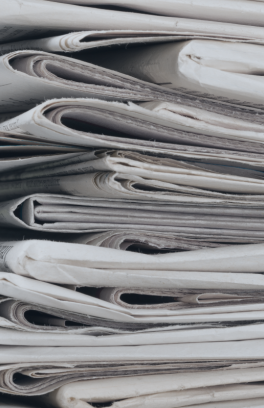 Newspapers stacked