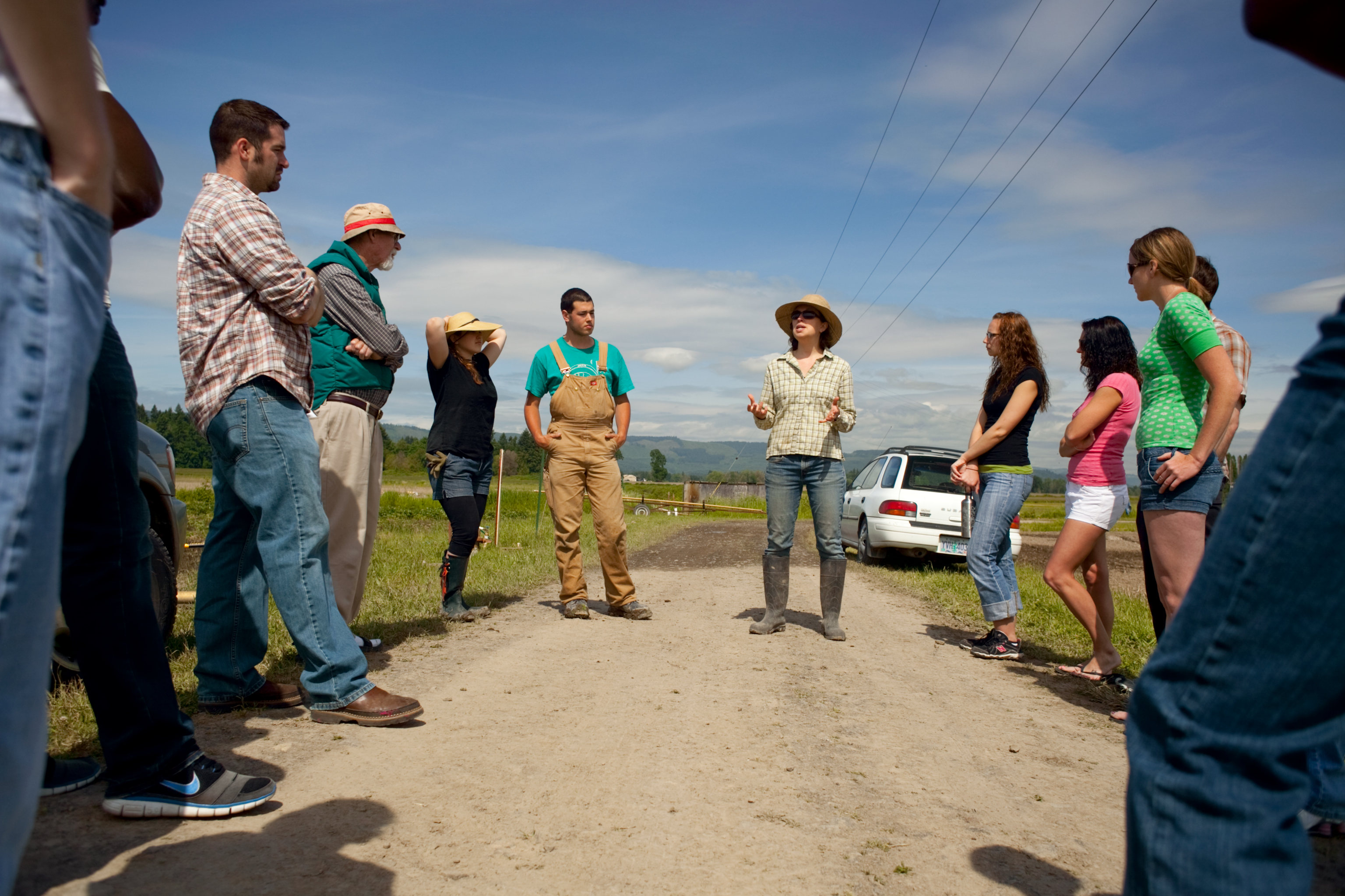 Group standing around outside getting instructions from a group leader