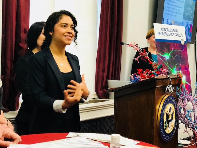 A student speaks at a podium