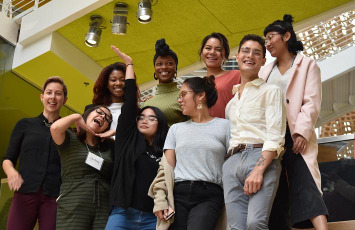 A group of students makes faces in silly group pose