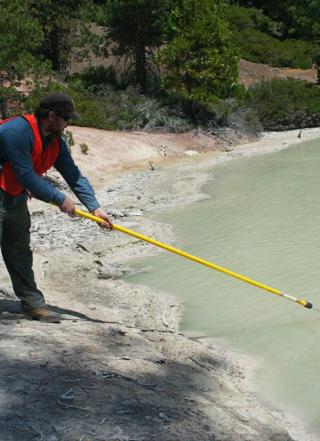 A student sampling microbes at Lassen National Park