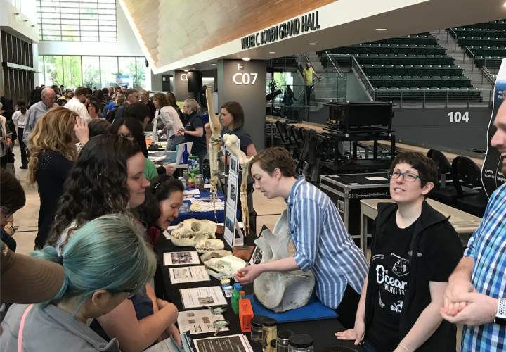 Students hosting a biology exhibit at an Ocean Sciences Event