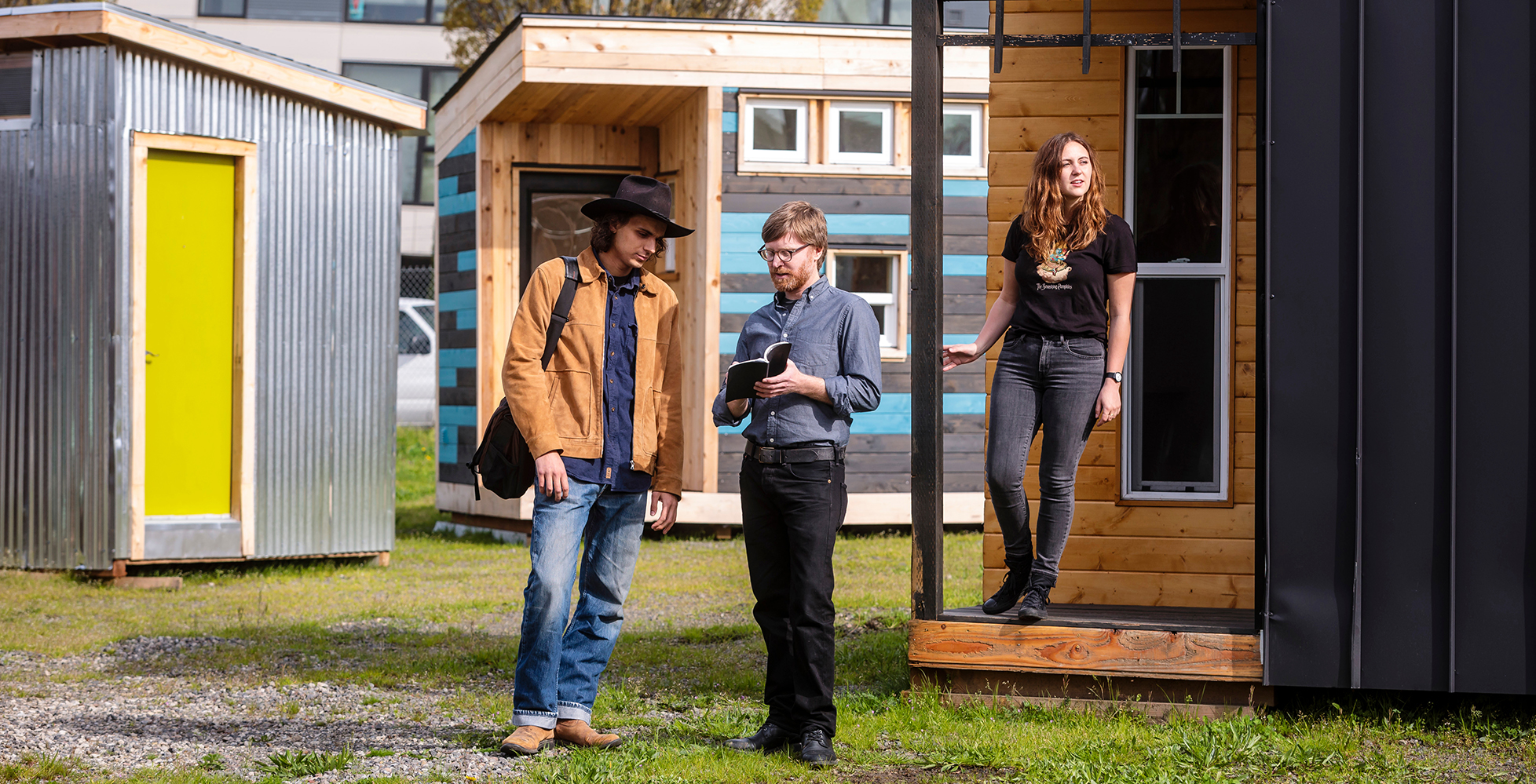 Todd Ferry and students at a tiny home village