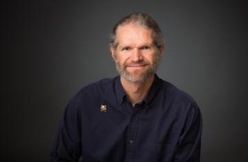 A head shot photo of Ken Stedman.