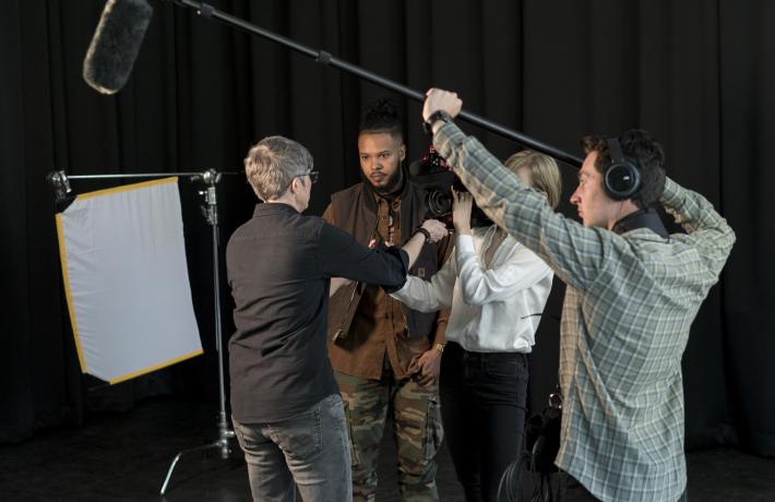 Filming with students and professor