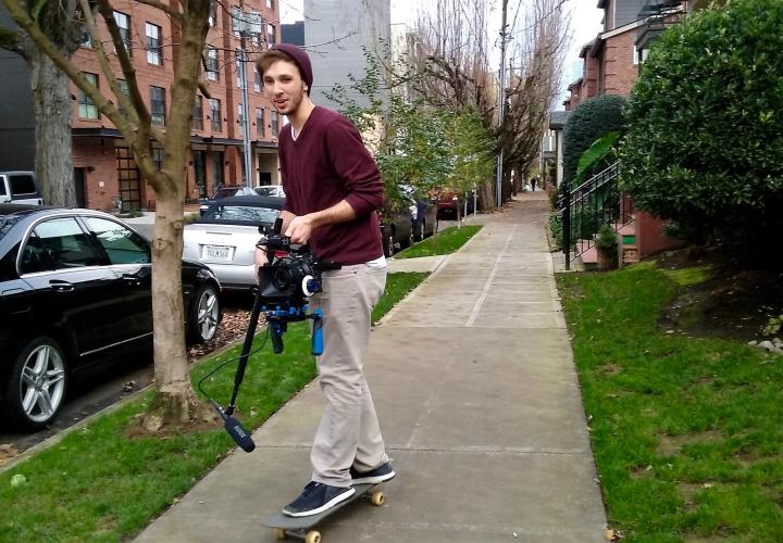 Student filming on skateboard