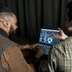 Students with laptop in studio