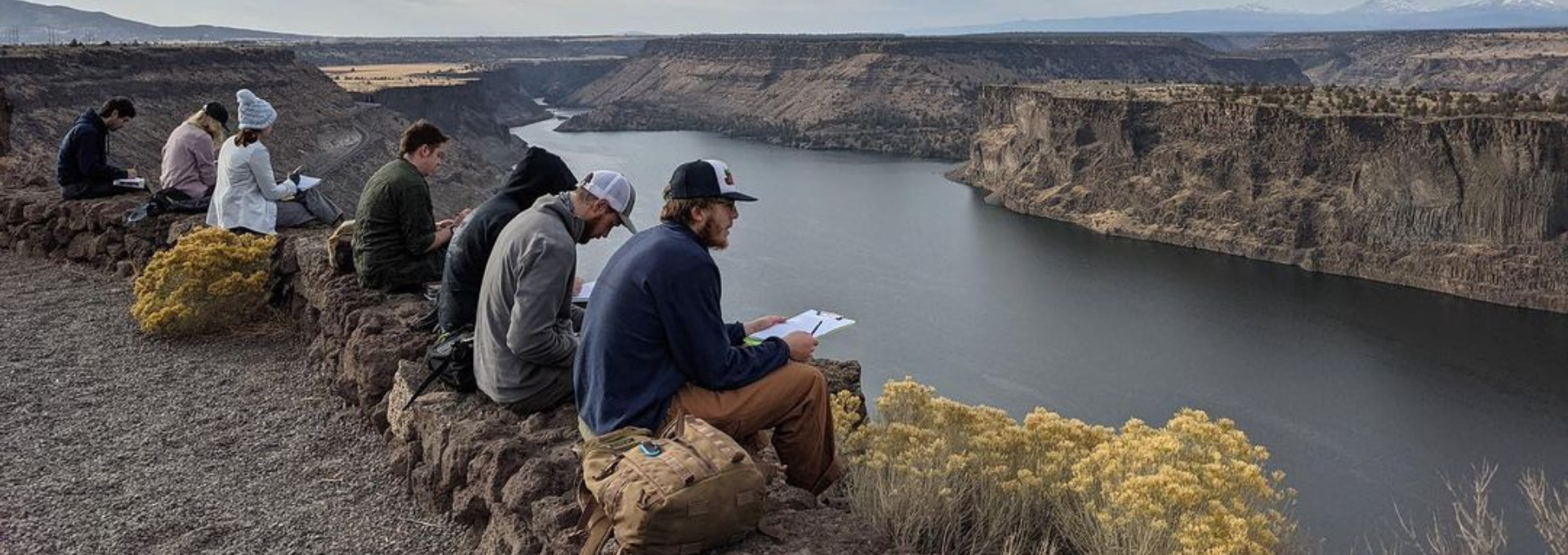 Students looking out onto reservoir