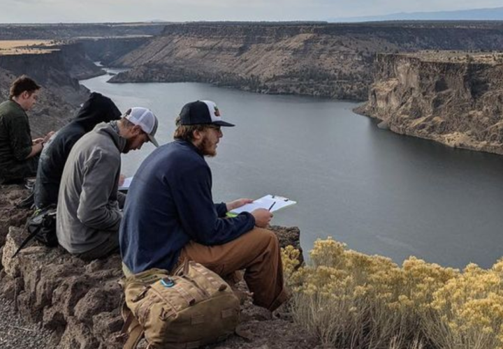 Students looking out onto reservoir