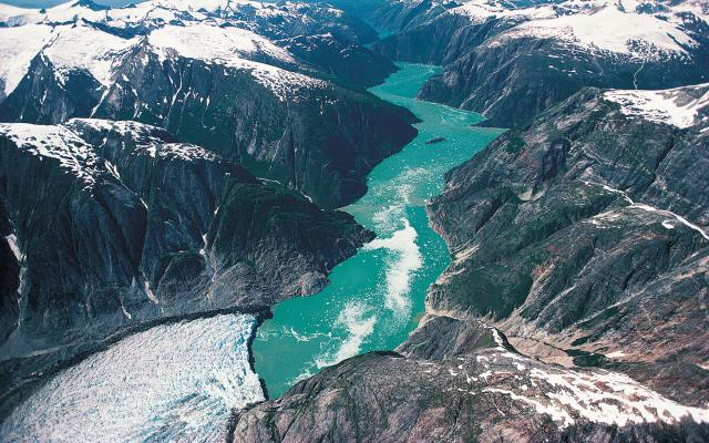 Glacier carving down a river valley