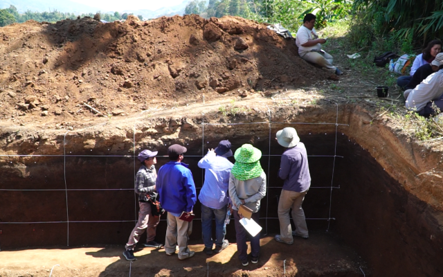 Ashley Streig instructs students on how to collect charcoal samples to be used for dating