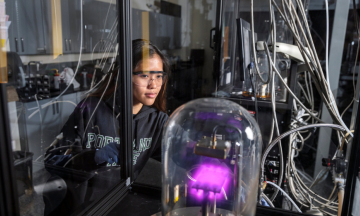 engineering student working in microchip manufacture lab