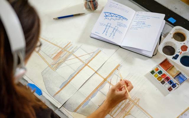 Person at drafting table