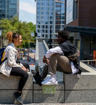 Student sitting on a ledge