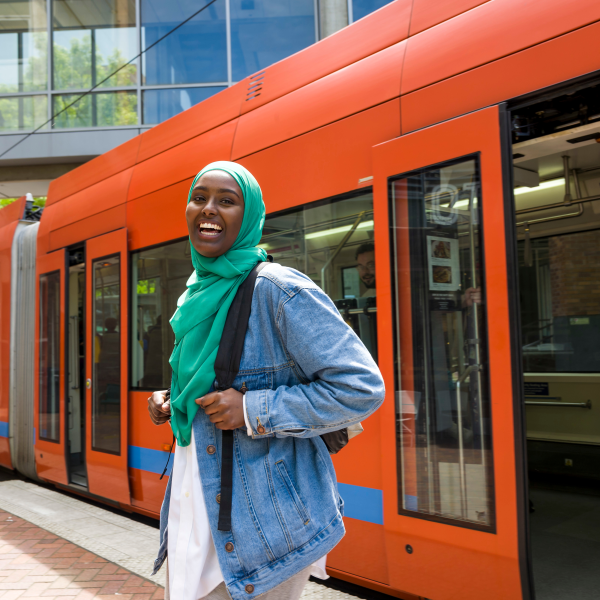 Student smiling outside of streetcart