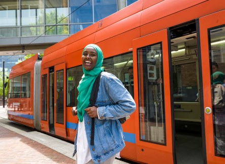 Student smiling outside of streetcart