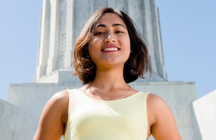 Woman standing outside of Oregon capitol building 