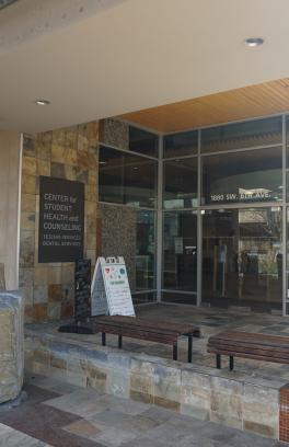 This photo is decorative. The Center for Student Health & Counseling (SHAC) front entry and doors to building.