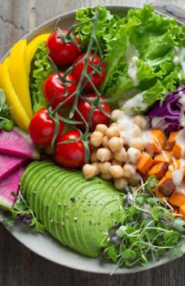 Colorful image of a plate of healthy and fresh fruits and vegetables.