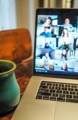 Mug and laptop computer showing a zoom meeting